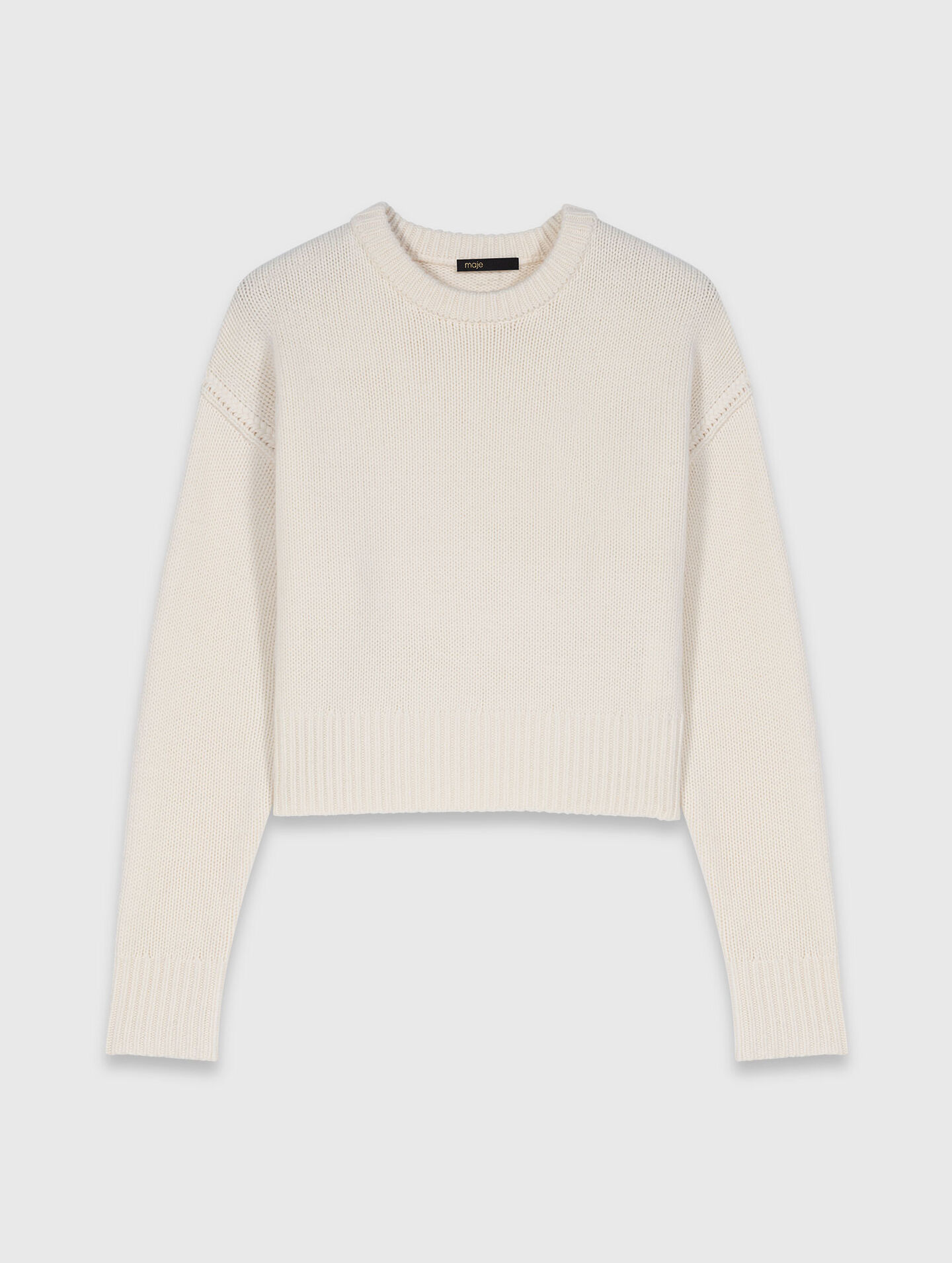 Pullover con spilla floreale